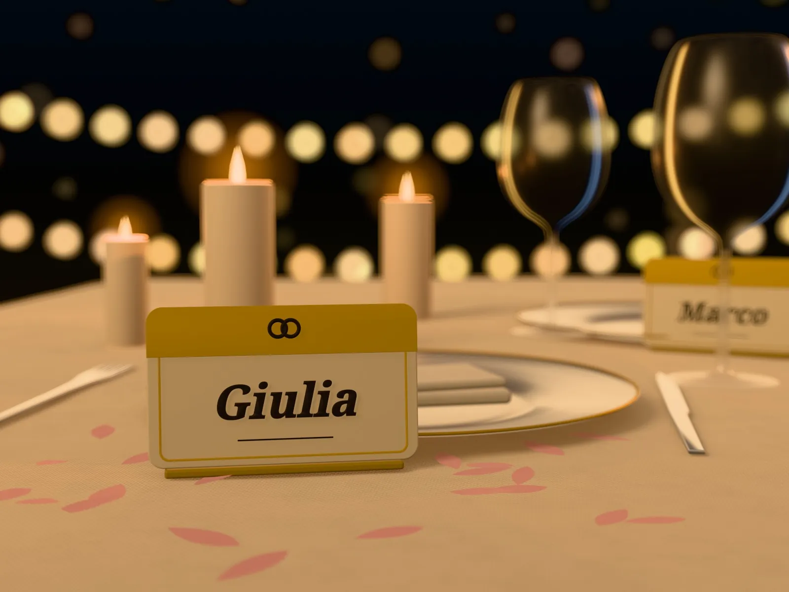 Segnaposto con il nome Giulia su una tavola apparecchiata a lume di candela